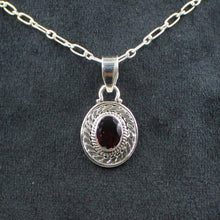 Ornate Oval Gemstone Pendant with Rope Design