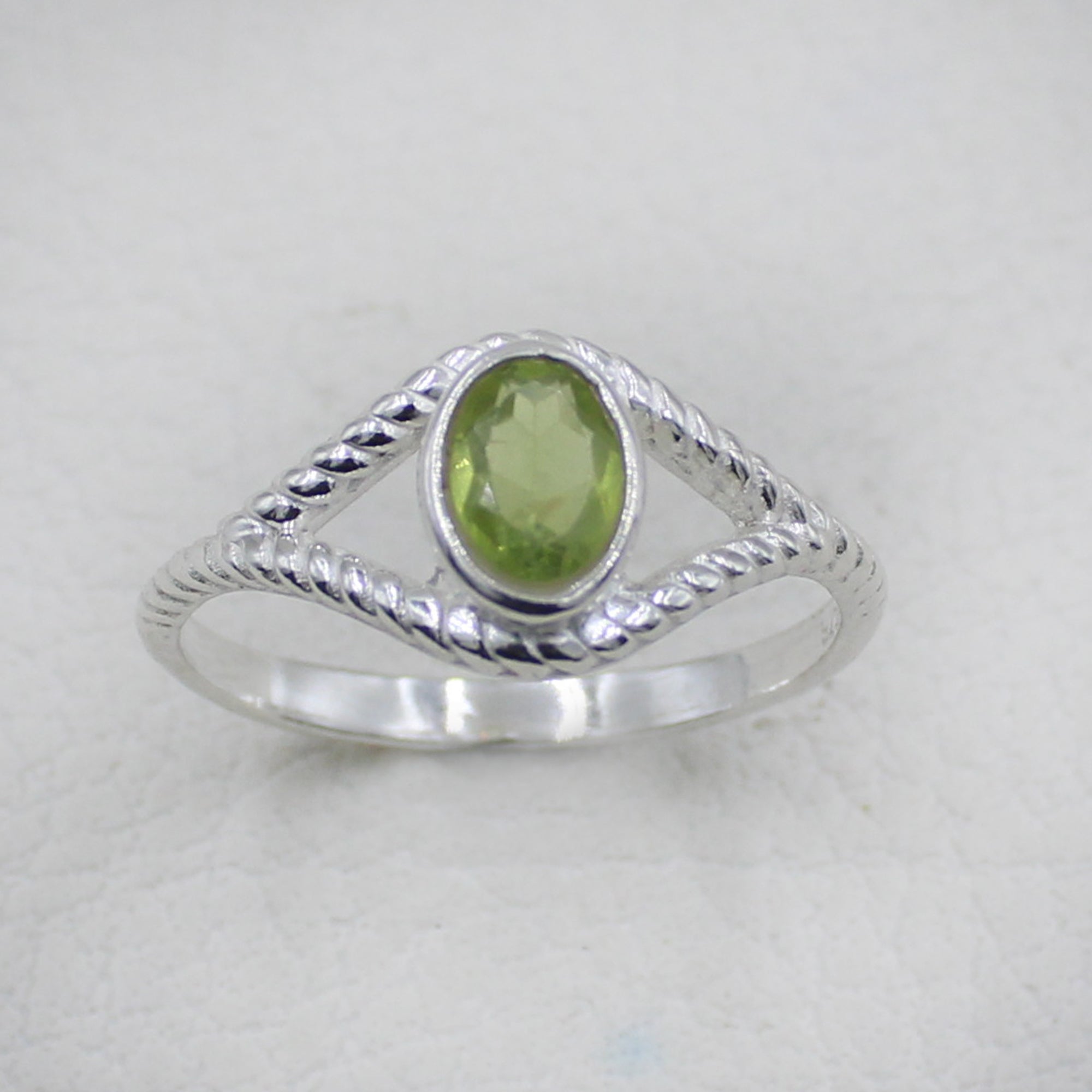 Sterling Silver Twisted Band Ring with Oval Peridot Gemstone