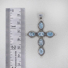 Sterling Silver Cross Pendant with Blue Topaz Oval Gemstones